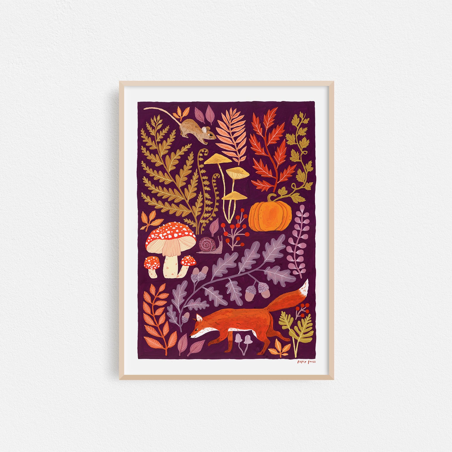 The Autumnal Fox Artists Print by Papio Press features vibrant autumn forest elements and is beautifully printed on archival-quality cotton paper, framed, and displayed on a white wall.