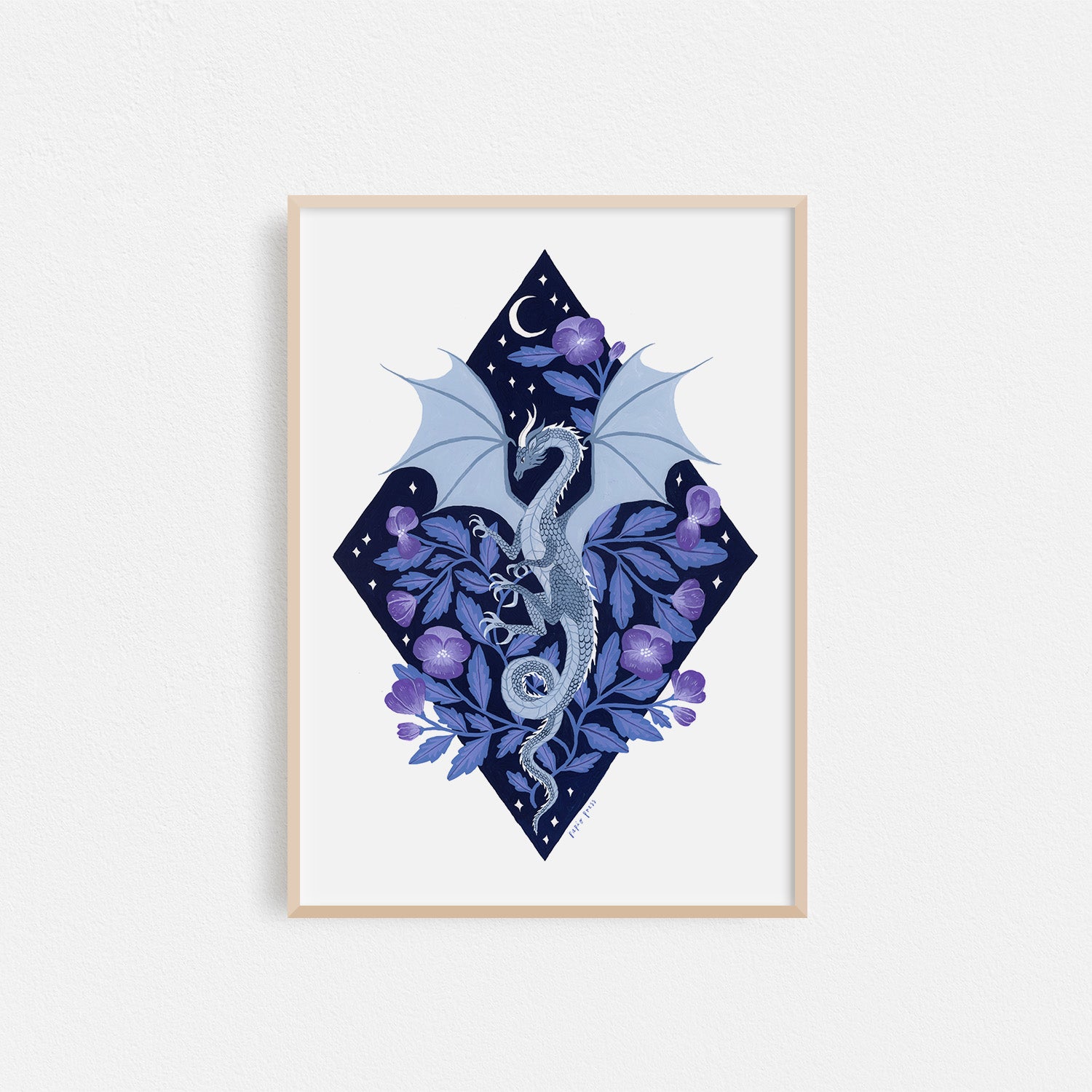 The Dragon Diamond Artists Print by Papio Press features a blue dragon winding through purple flowers on a starry, moonlit diamond background, printed as an archival-quality illustration on 100% cotton paper.