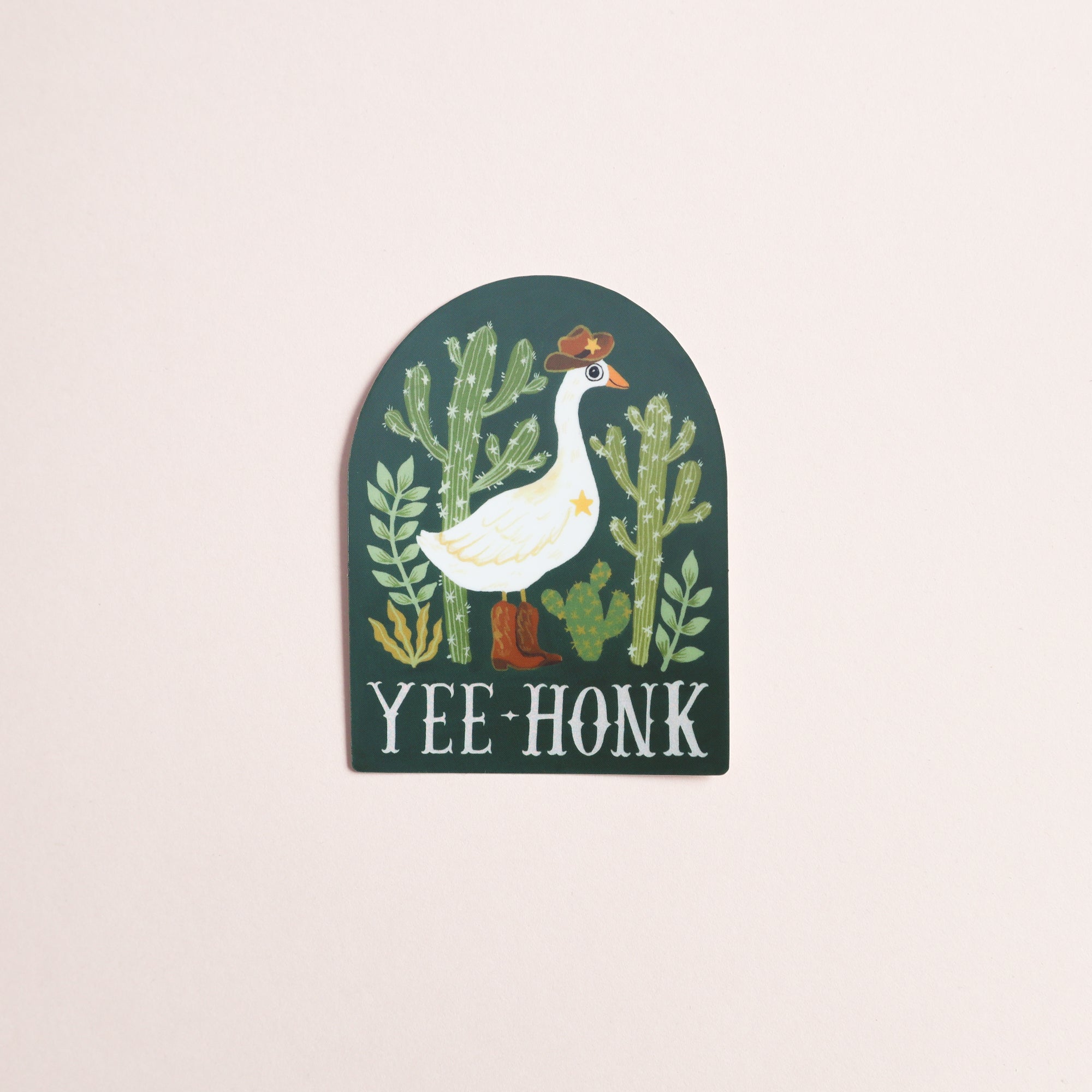 The Papio Press Yee-Honk Goose Sticker is a glossy vinyl decal showing a cowboy goose in hat and boots among green cacti with YEE HONK text, all on a dark background.