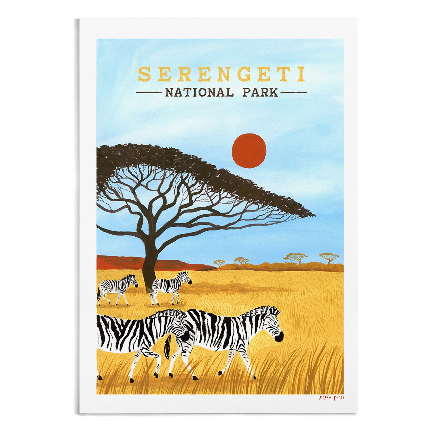 The Serengeti National Park Artists Print by Papio Press features zebras in golden grass, an acacia tree, and a red sun in a blue sky. Inkjet printed on archival satin paper with Serengeti National Park at the top.