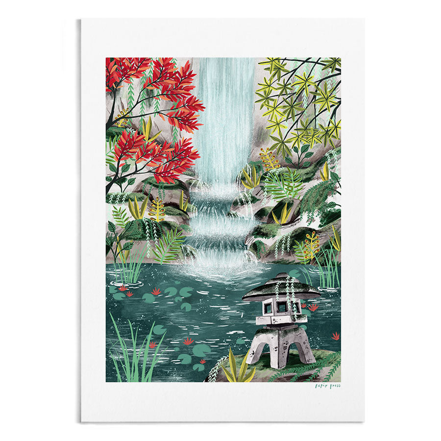 A Japanese shrine in a zen garden in front of a waterfall.