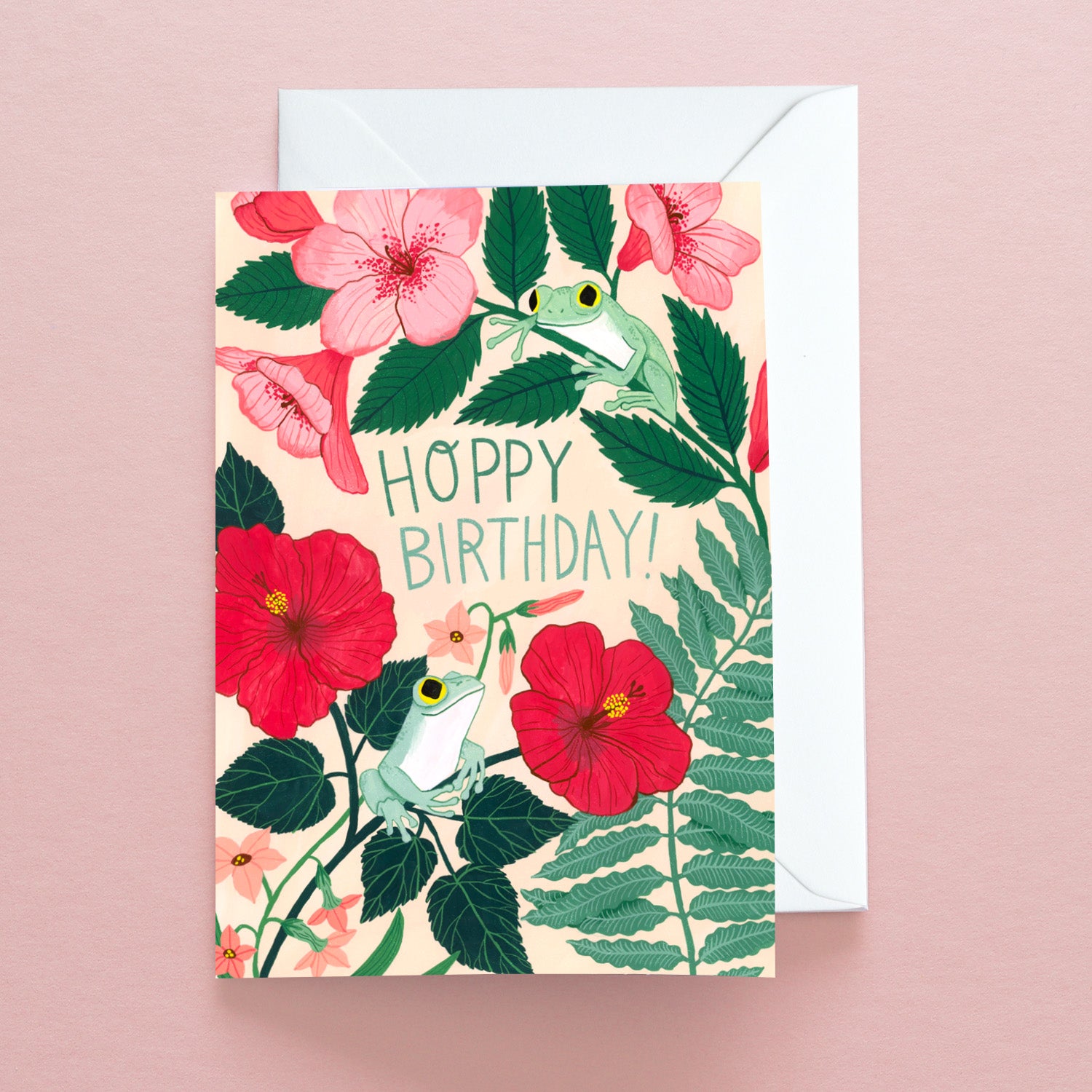 Papio Press Hoppy Birthday Frogs Greetings Card features two green frogs among red and pink flowers with HOPPY BIRTHDAY! message. Printed on recycled stock and includes an envelope.