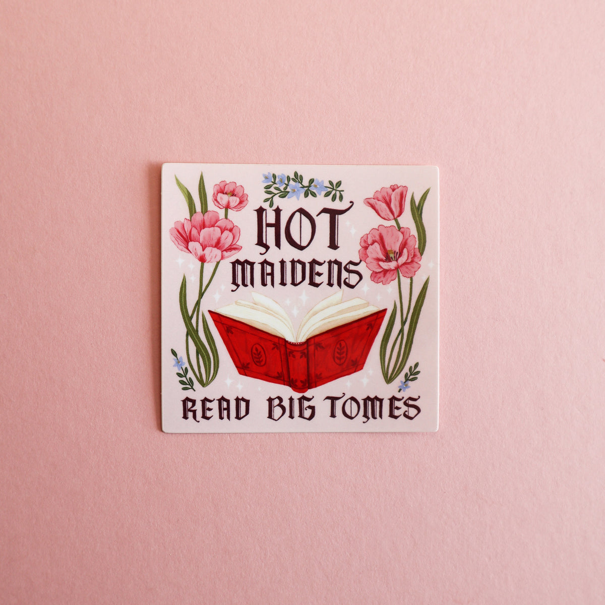 A square sticker featuring a red book with the text 'Hot Maidens Read Big Tomes'.