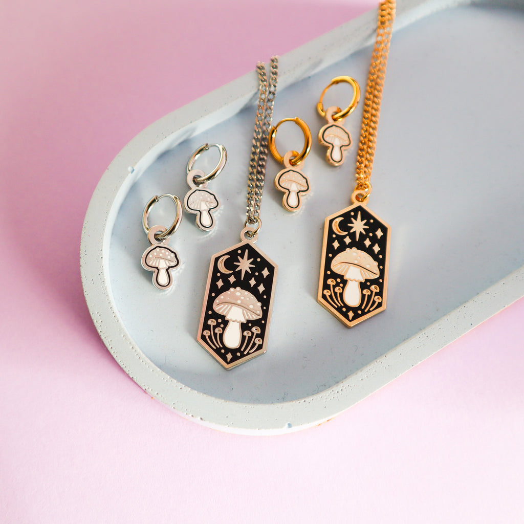 A selection of mushroom Papio Press jewellery.