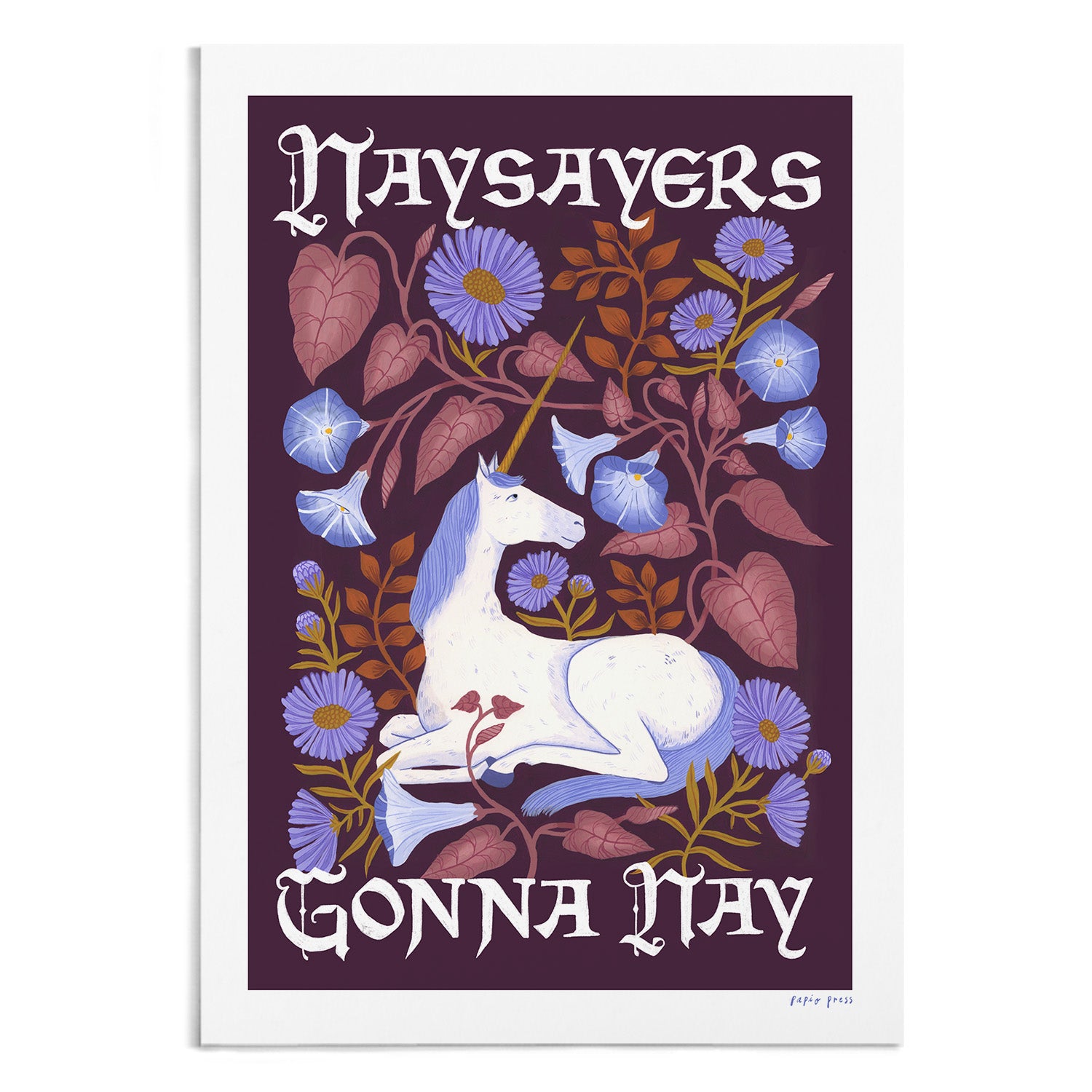 A photograph of a unicorn print. The unicorn is surrounded by flowers. It features the type 'Naysayers gonna nay' in a script font. 