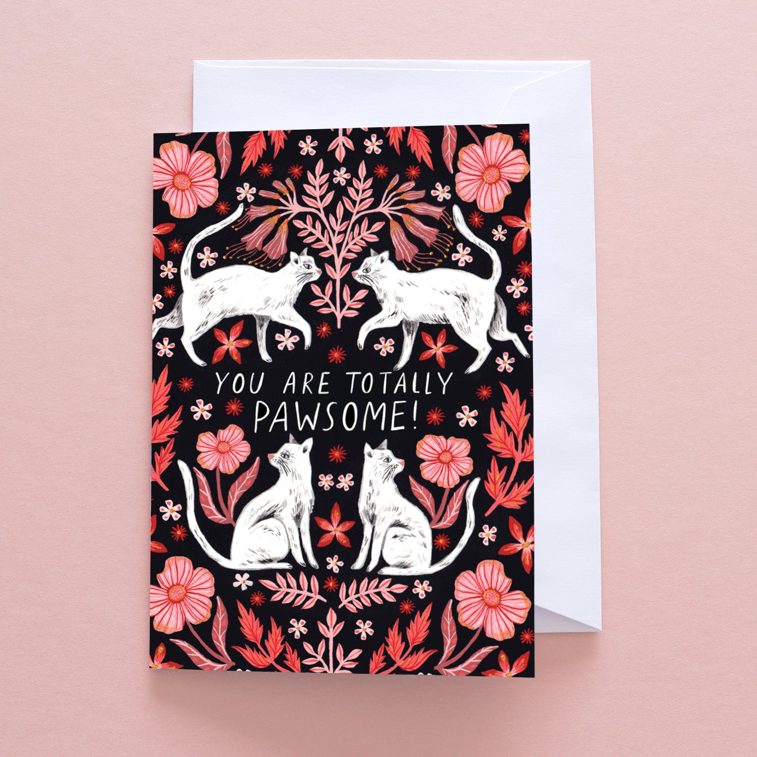 Papio Press You Are Totally Pawsome Greetings Card features white cats and pink flowers on a dark background, with the text “You are totally pawsome!” Printed on recycled stock, card comes with a white envelope.