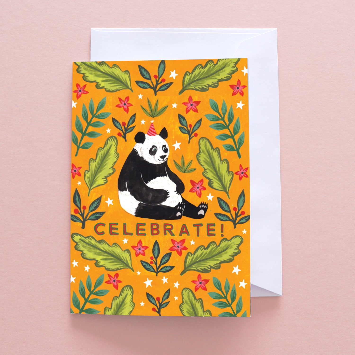 The Celebrate Panda Greetings Card by Papio Press features a cheerful panda in a party hat amid green leaves and red flowers on an orange background, with CELEBRATE! in bold letters below.