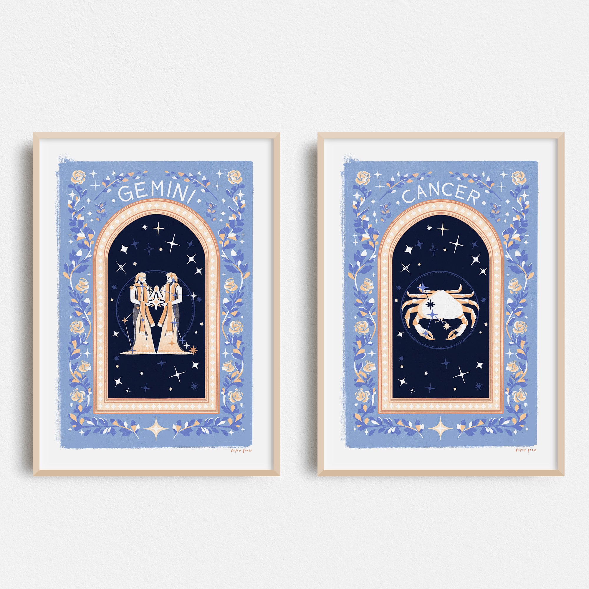 Papio Presss Choose your own Constellation Print // Star Signs features vibrant, archival satin prints with decorative blue backgrounds, stars, florals, and ornate borders—select your favorite zodiac sign to display on your wall.